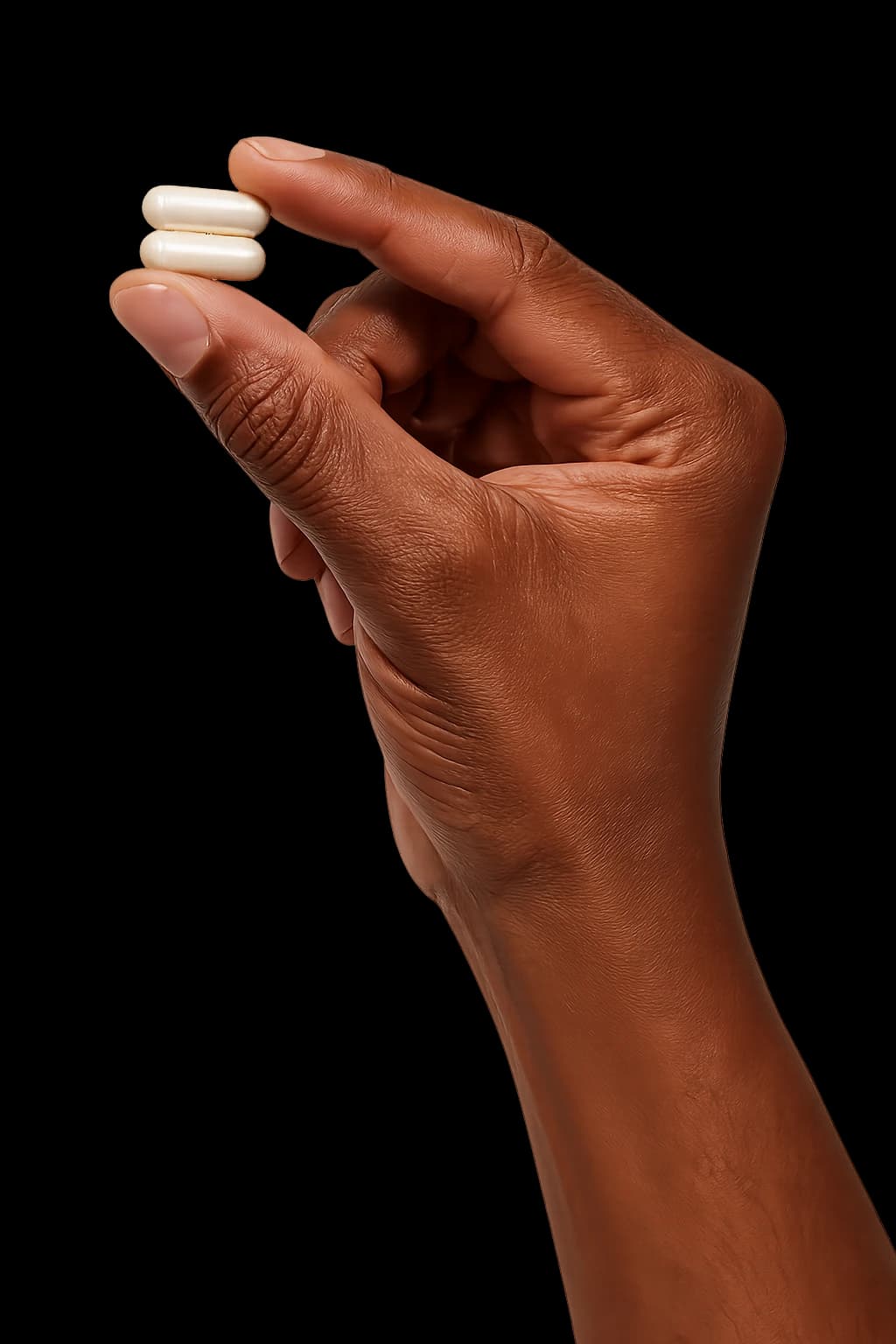 Hand holding two Morning Mate capsules